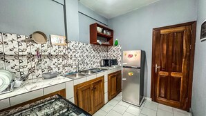 Departamento Deluxe, vista a la ciudad | Cocina privada