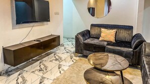 Departamento de lujo, vista a la ciudad | Área de sala de estar