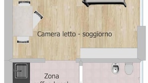 A hotel room layout with a bed, a seating area, a coffee break zone, a bathroom, and an entrance. - The Two Olive Trees - North (Campo nell'Elba)