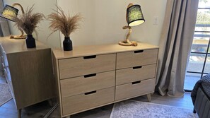 A wooden dresser with four drawers and a lamp on top. - Stylish 2 bedroom + loft with rooftop patio and views near Beverly Hills (Beverly Hills)