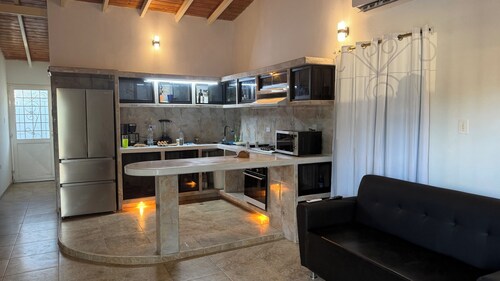Cozy 2-bedroom house in peaceful Guanare with AC.