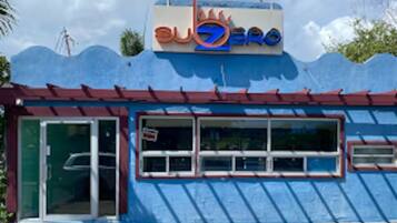A building with a sign that reads 'subzero' and a blue exterior.