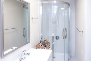Shower, hair dryer, towels, soap