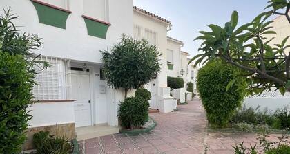 Two-story house in P. Andaluz/Torróx Costa. 3 bedrooms, sleeps 5, and community pool