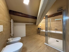 A modern bathroom with a shower, toilet, and sink. - Il Pittore by Interhome (Pisa)