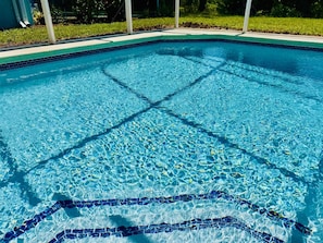 A clear swimming pool with a tiled edge and a visible pool ladder. - 641 Fabulous 4 bed Villa in Conservation Area with Water View (Davenport)