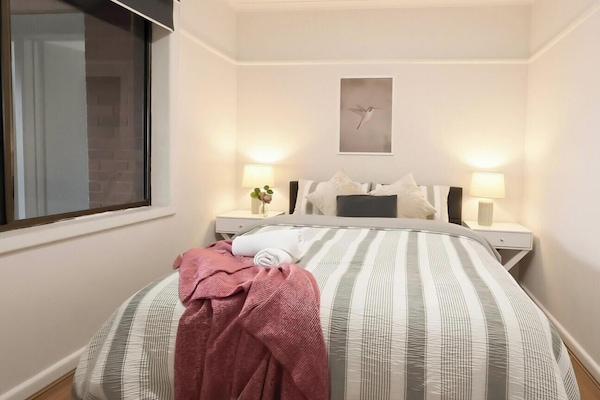 Clean and comfortable bedroom with fresh linens