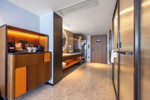 A modern kitchen with a built-in coffee machine, a microwave, and a coffee station. - UrCove by Hyatt BeiJing Wangjing 798  (Beijing)