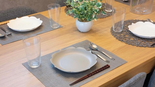A dining table set with plates, cutlery, glasses, and chopsticks. - 87㎡House/4 min Station/Haneda straight limo bus/Near Disneyland/3 Bedrooms (Katsushika City)