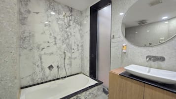 Suite, City View | Bathroom | Hair dryer, towels, soap, shampoo