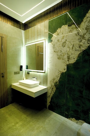 Suite, 1 King Bed, Air conditioning | Bathroom | Shower, slippers, towels, soap - Goldys Hotel Banquets & Restaurant (Hisar)