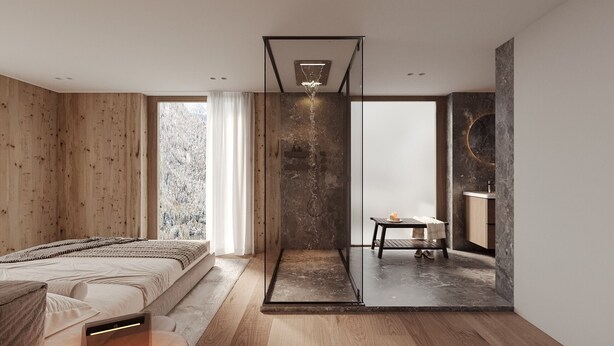 Ein modernes Schlafzimmer mit einem Bett, einer Glastrennwand, einem kleinen Tisch mit Kerzen sowie einem Badezimmer mit Marmorwand.