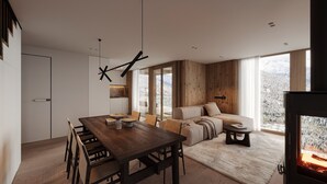 Ein modernes Interieur mit Essbereich, Sofa und Kamin.