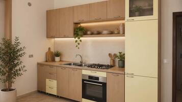 Coffee/tea maker, fridge, microwave, oven
