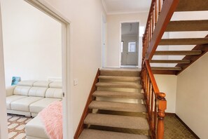 A staircase with wooden handrails leading to a door. - Peaceful 1BDR Private Stay in Chiswick (Chiswick)