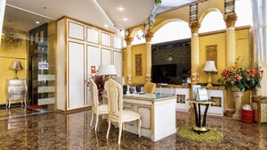 A luxurious hotel lobby with marble flooring, a reception desk, a seating area with chairs, and a large decorative mirror. - Sunday- Johor Bahru Near Mid Valley Southkey Formally Lace Boutique (Johor Bahru)