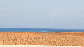A beach with a clear view of the ocean and a sandy landscape. - JoLi Penthouse — 60m² Rooftop Terrace, 360° View (Santa Maria)