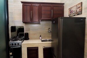 Suíte júnior, sacada | Cozinha privada