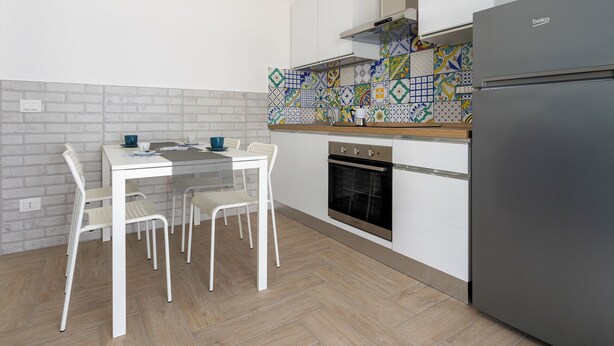 Apartamento conforto, sacada, vista para o mar | Cozinha privada