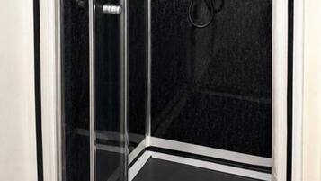 Shower, deep soaking tub, towels