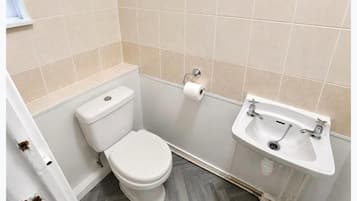 Shower, deep-soaking bathtub, towels