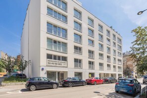 A multi-story building with a row of balconies on each floor. - Functional Studio Close to the Metro in Warsaw by Noclegi Renters (Warszawa)