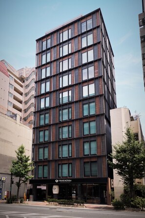A modern multi-story building with a glass facade and a sign for 'Grand Monday' at the ground level. - GRAND MONday KYOTO SHIJO KAWARAMACHI (Kyoto)