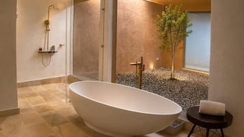Separate bathtub and shower, slippers, towels, soap
