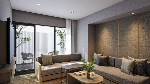 A modern living room with a sofa, coffee table, and a television.