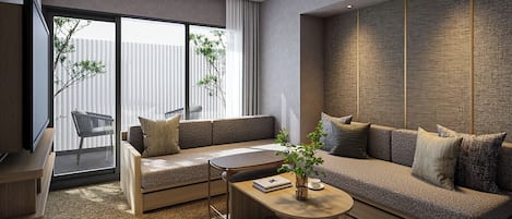 Una sala de estar moderna con un sofá, una mesa de centro y una televisión.