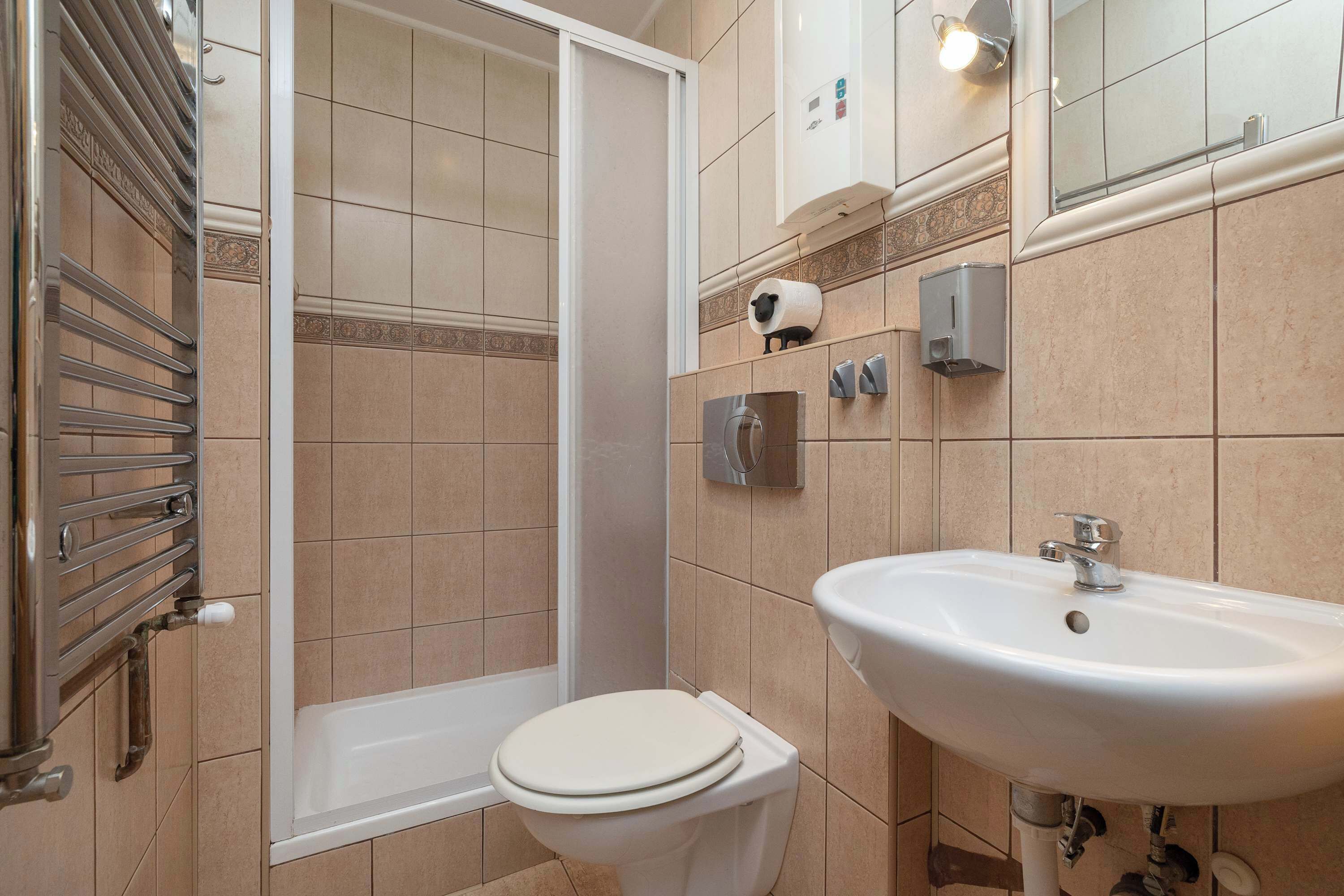 Shower, hair dryer, towels, shampoo