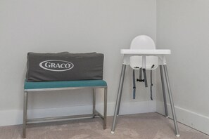 A baby changing station with a Graco brand cushion and a white high chair. - 1/4 mile to Beach~Dogs OK~Pool~Grill~Master Suite (Santa Rosa Beach)