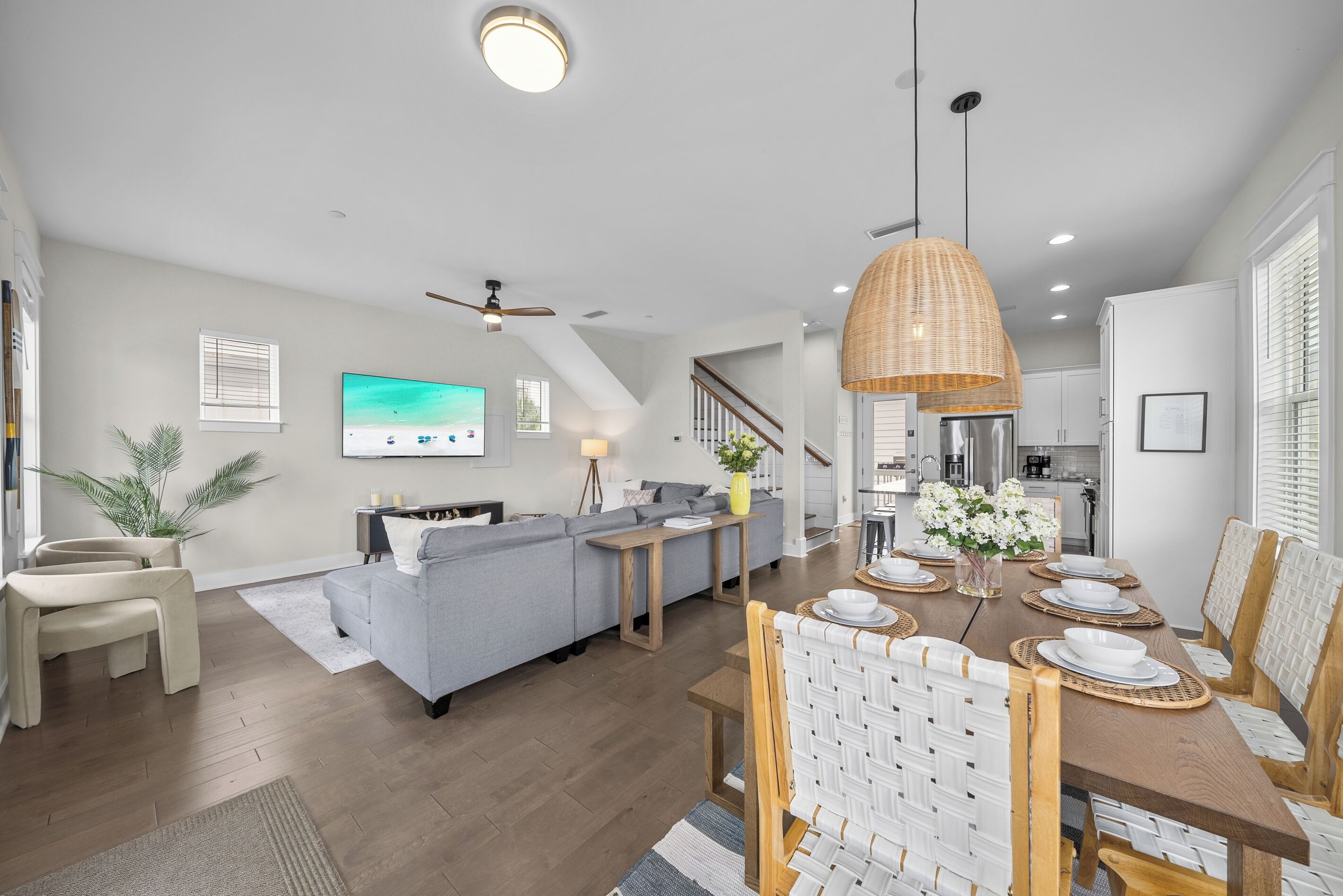 Living, dining, and kitchen all share one bright open level, so whoever's cooking is still part of the conversation.