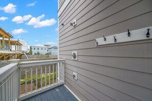 A residential building with a wooden deck and a white railing. - Dogs OK~Community Pool~Short Walk to Beach~Grill (Santa Rosa Beach)