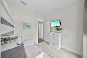 A bedroom with a bed, a dresser, a television, and a painting. - Dogs OK~Community Pool~Short Walk to Beach~Grill (Santa Rosa Beach)