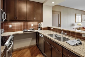 Coffee/tea maker, fridge, microwave, oven