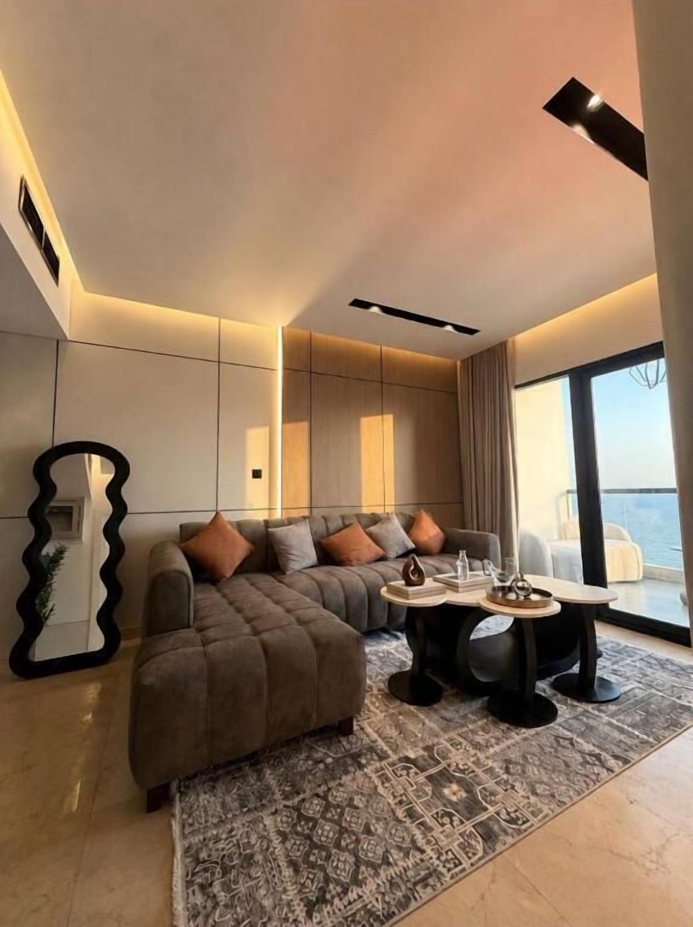 Suite Confort, balcón, vista al mar | Área de sala de estar
