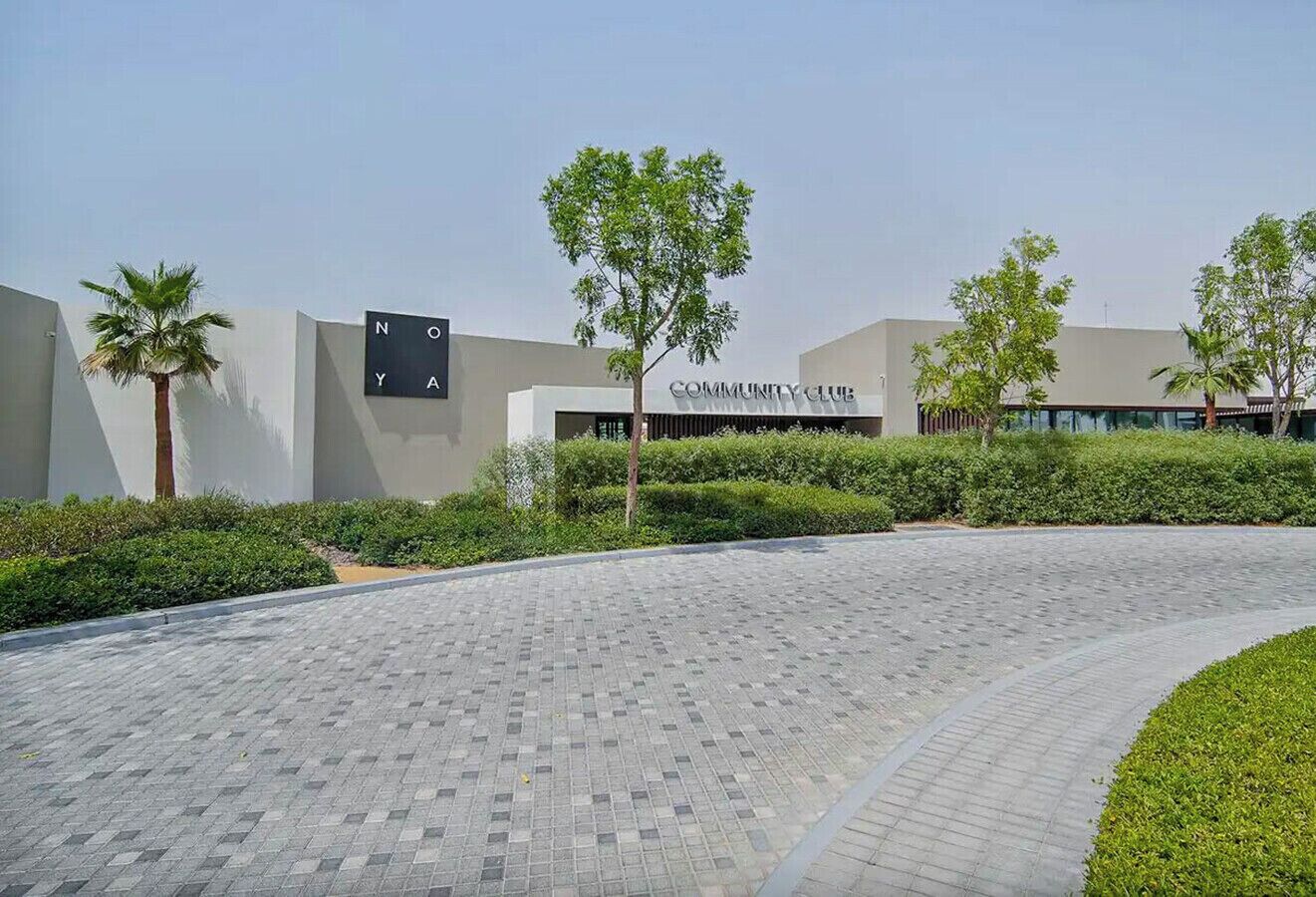 A modern building with a sign that reads 'COMMUNITY CLUB.'
