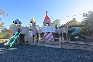 A playground with a slide, climbing structures, and a rope bridge. - 🦩Book Me Baby! See You at the Bayou in Miramar Beach🦩 (Miramar Beach)