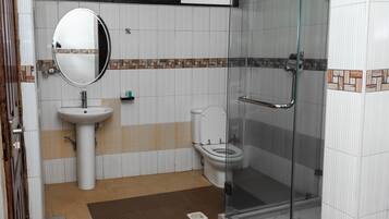 Shower, slippers, towels, soap