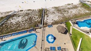 A resort with a large swimming pool, a separate pool area, and a beach. - Phoenix Iv 4082 1 Bedroom Condo (Orange Beach)
