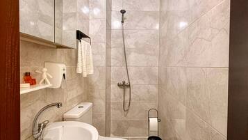 Shower, hair dryer, towels, soap