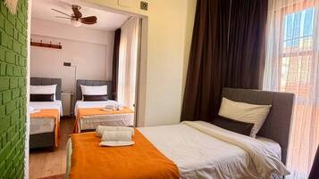 Triple Room, 3 Single Beds | Iron/ironing board (on request), free WiFi