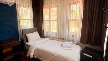 Basic Single Room | Iron/ironing board (on request), WiFi (free)