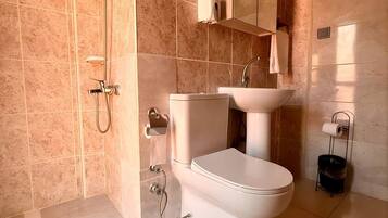 Triple Room, 3 Single Beds | Bathroom | Shower, hair dryer, towels, soap