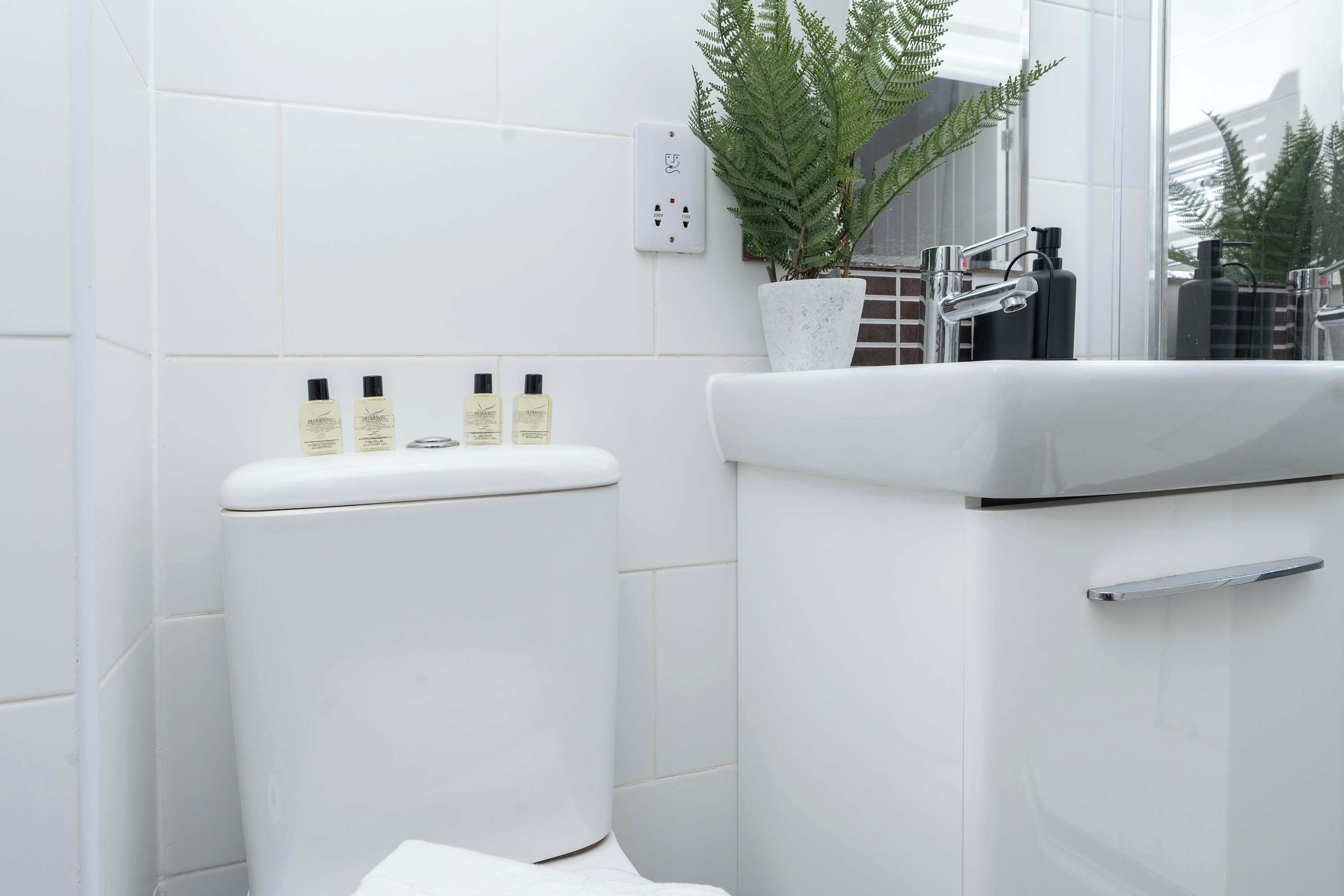 Shower, hair dryer, towels, shampoo