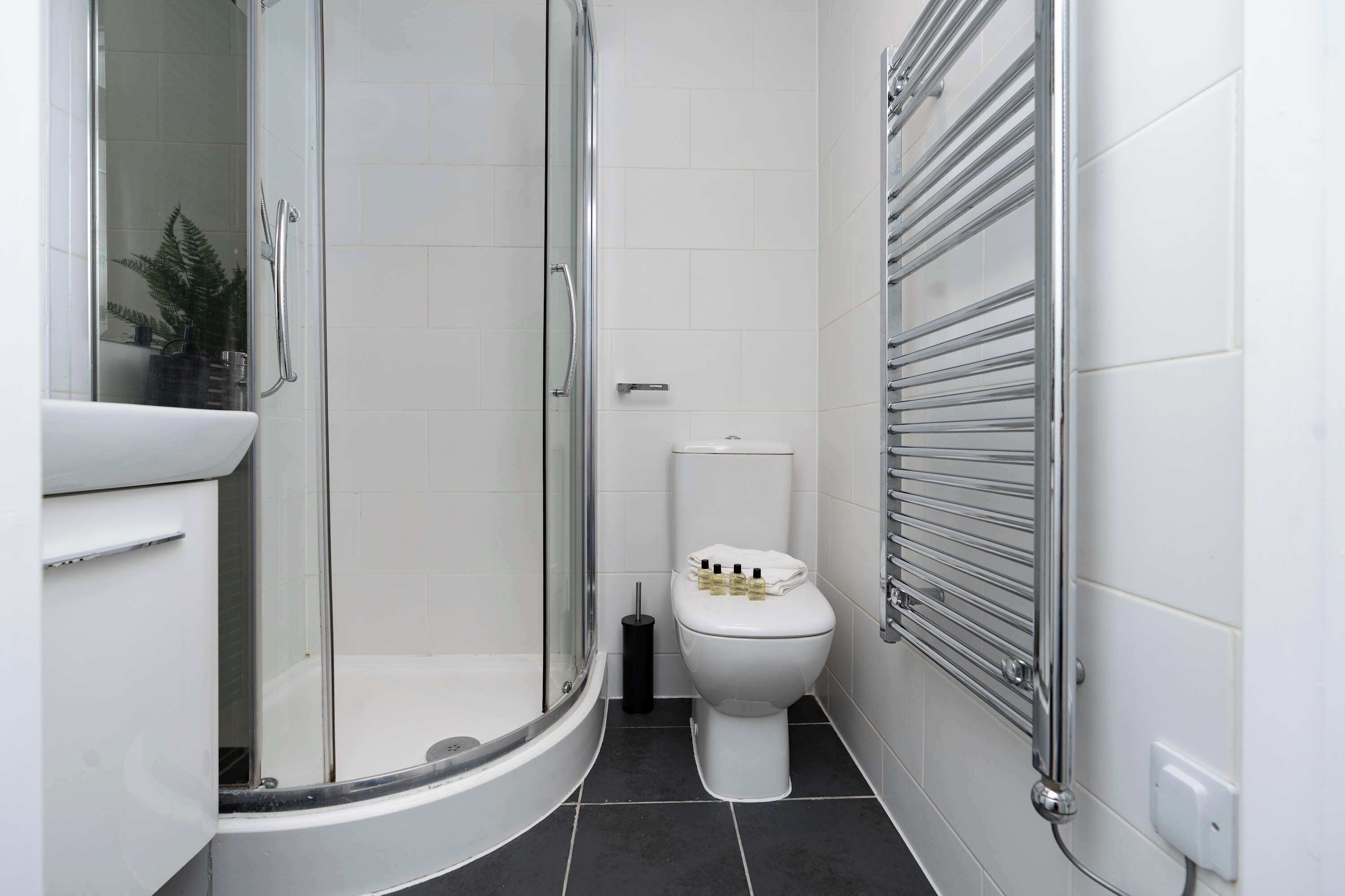 Shower, hair dryer, towels, shampoo