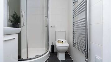 Shower, hair dryer, towels, shampoo