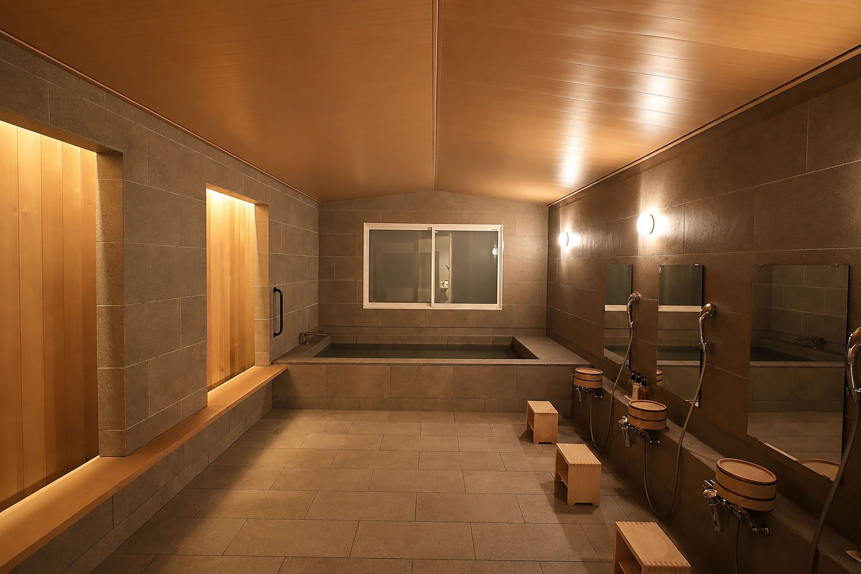 A modern bathroom with a wooden vanity, a large mirror, and a bathtub.