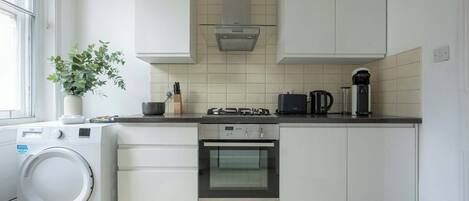 Coffee/tea maker, fridge, microwave, oven